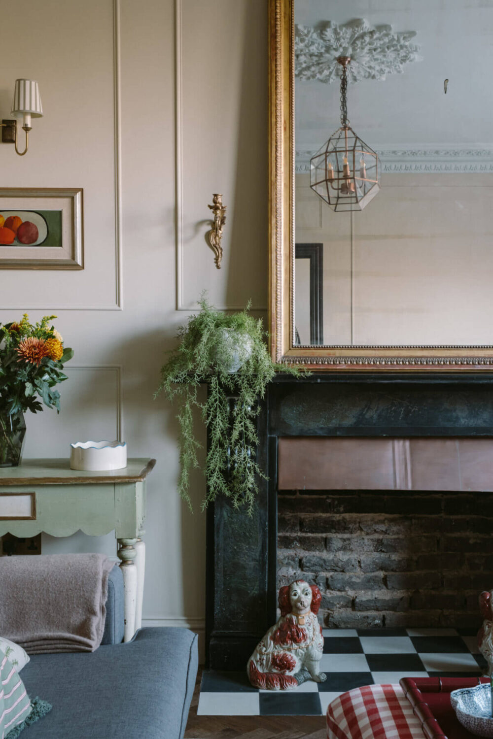 A Deep Red Kitchen in a Victorian Home in London 2 black-fireplace-detail-large-antique-mirror-nordroom