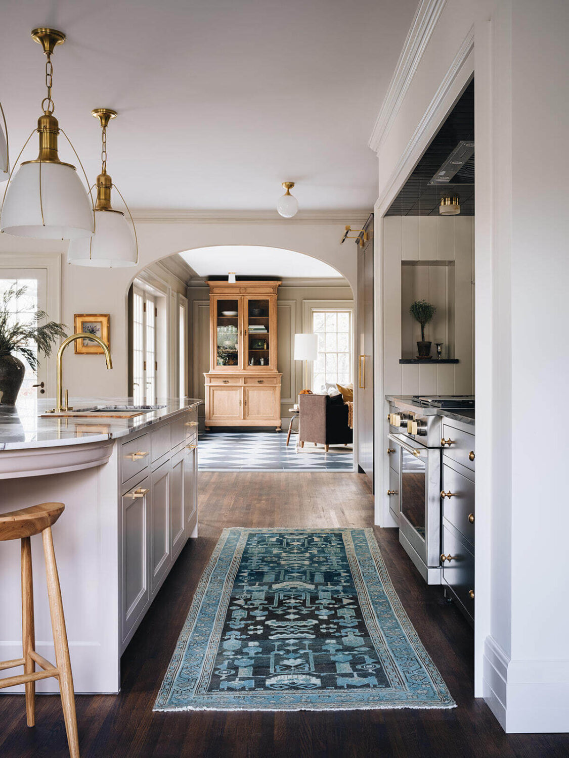 A Classic 1930s Home in Grand Rapids Designed by Jean Stoffer 11 blue-runner-kitchen-wooden-floor-island-foyer-living-room-open-plan-nordroom