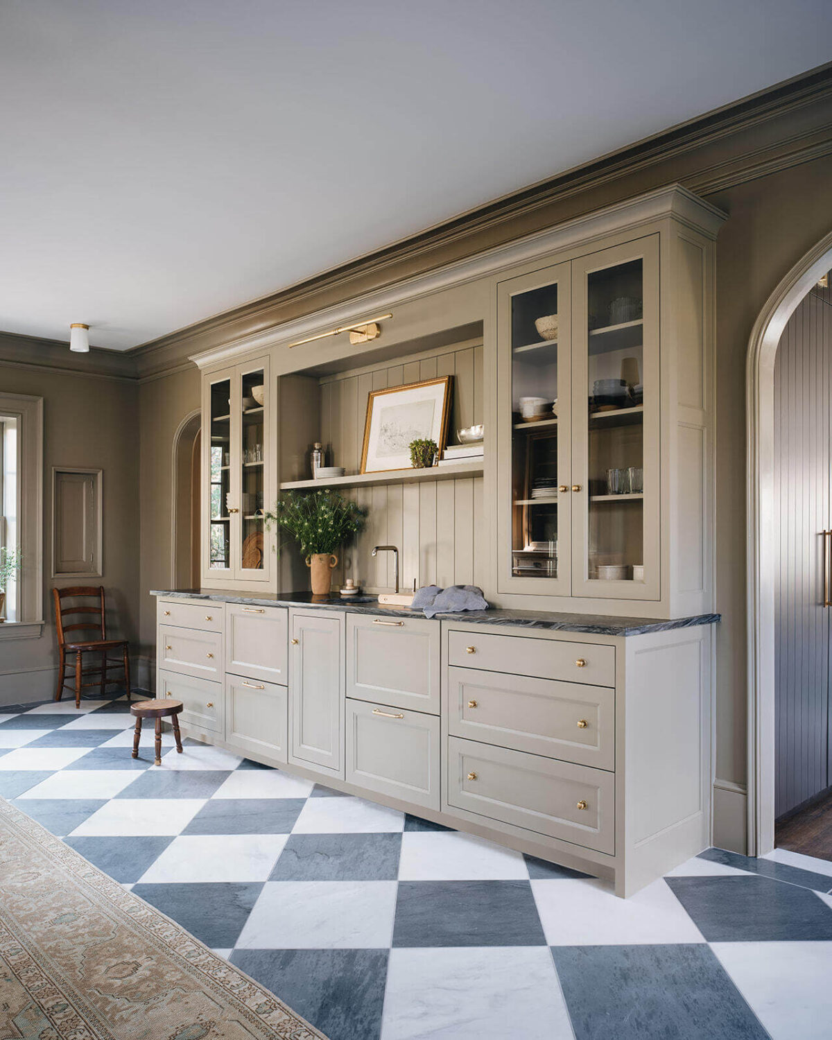 A Classic 1930s Home in Grand Rapids Designed by Jean Stoffer 3 built-in-cabinets-bar-living-room-checkerboard-floor-nordroom