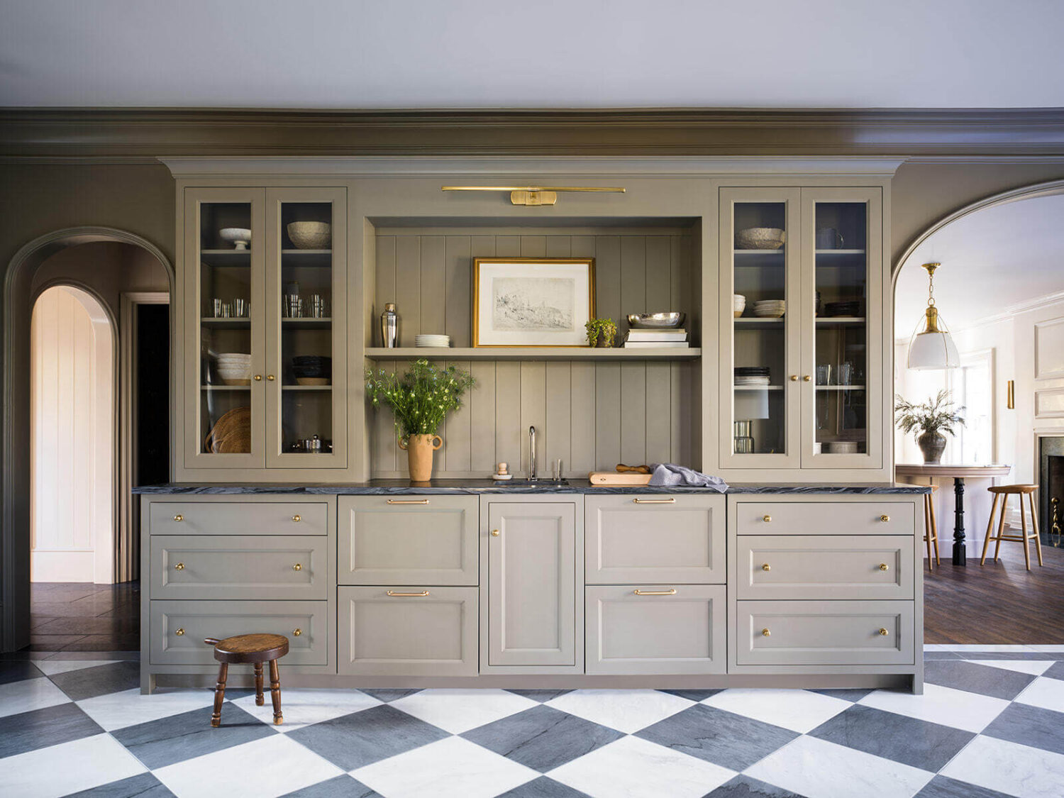 A Classic 1930s Home in Grand Rapids Designed by Jean Stoffer 5 built-in-cabinets-bar-sink-checkerboard-floor-arches-living-room-nordroom
