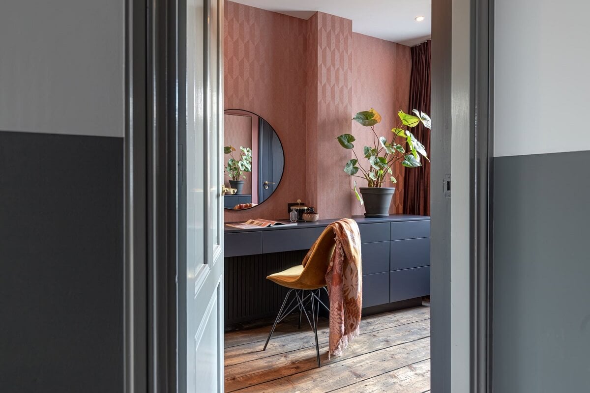 Gray and Earth Tones in a Restored Weavers House in The Netherlands 15 built-in-vanity-table-pink-wallpaper-round-mirror-nordroom