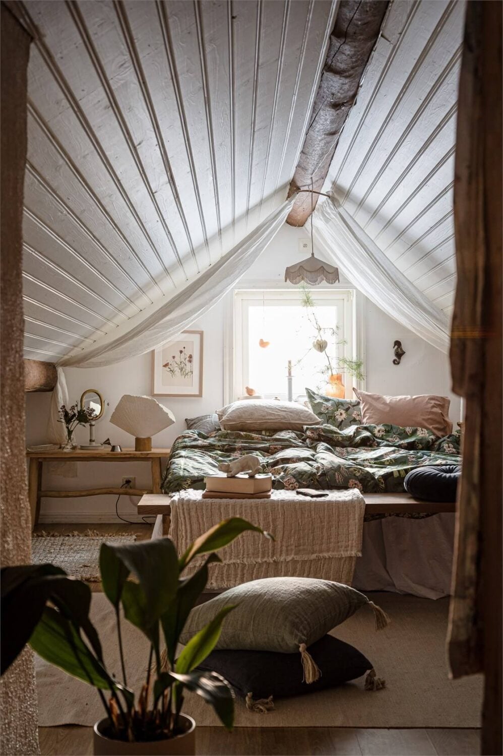 A Charming Countryside Villa in Sweden 22 cozy-bedroom-slanted-ceiling-exposed-beams-country-house-sweden-nordroom