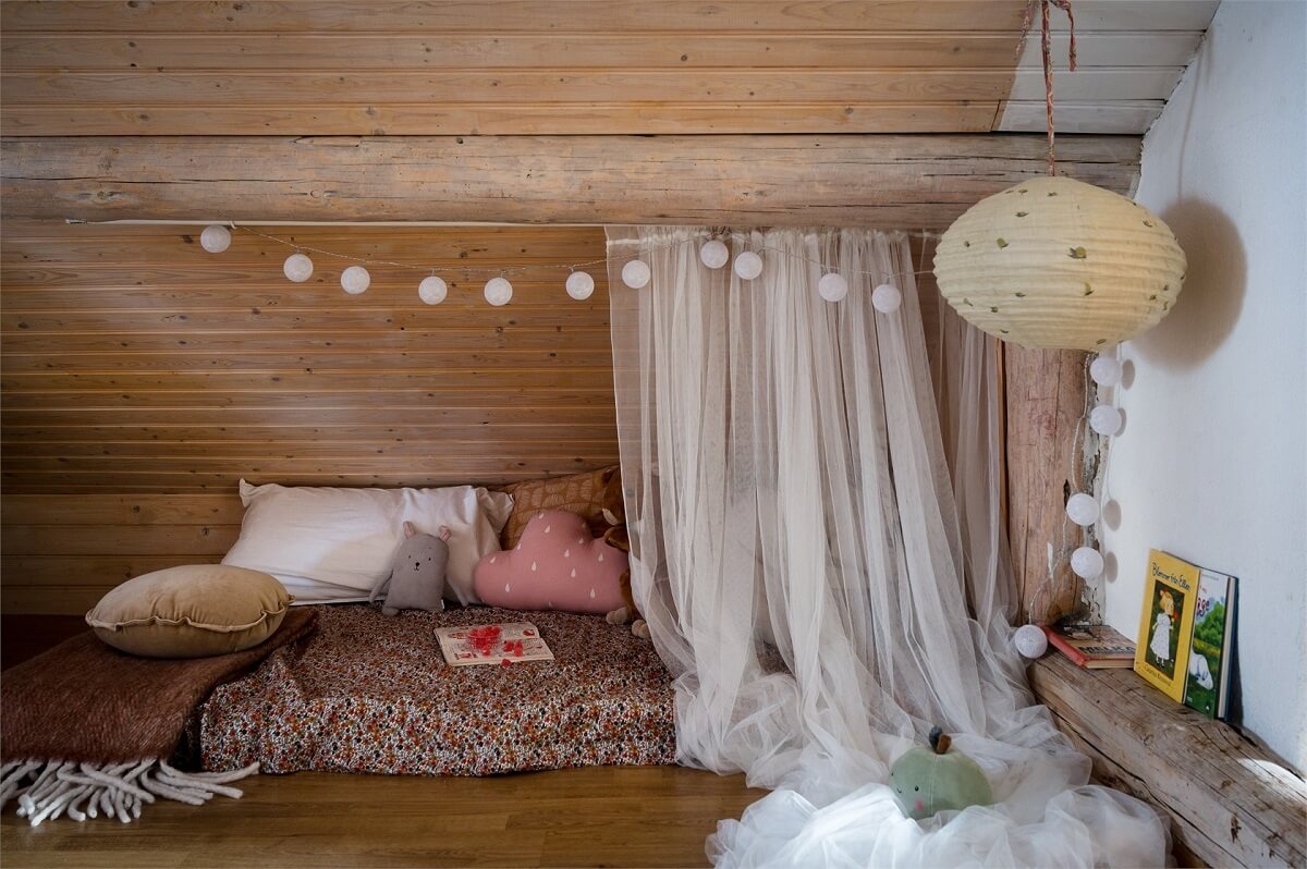 A Charming Countryside Villa in Sweden 23 cozy-reading-snug-slanted-ceilings-nordroom