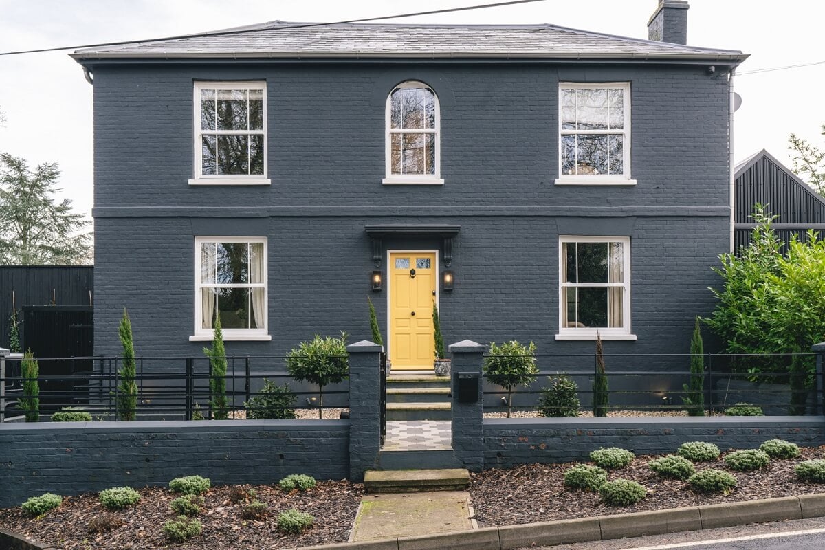 A Victorian Home with a Modern Black Extension 31 dark-gray-victorian-home-yellow-front-door-nordroom