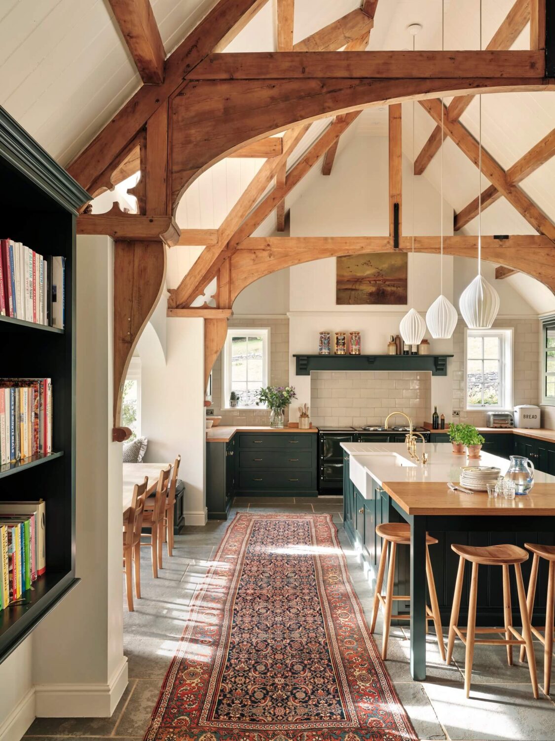 A Grand Family Kitchen in an English Country House 2 devol-kitchen-exposed-wooden-beams-loft-ceiling-kitchen-island-kilim-runner-nordroom