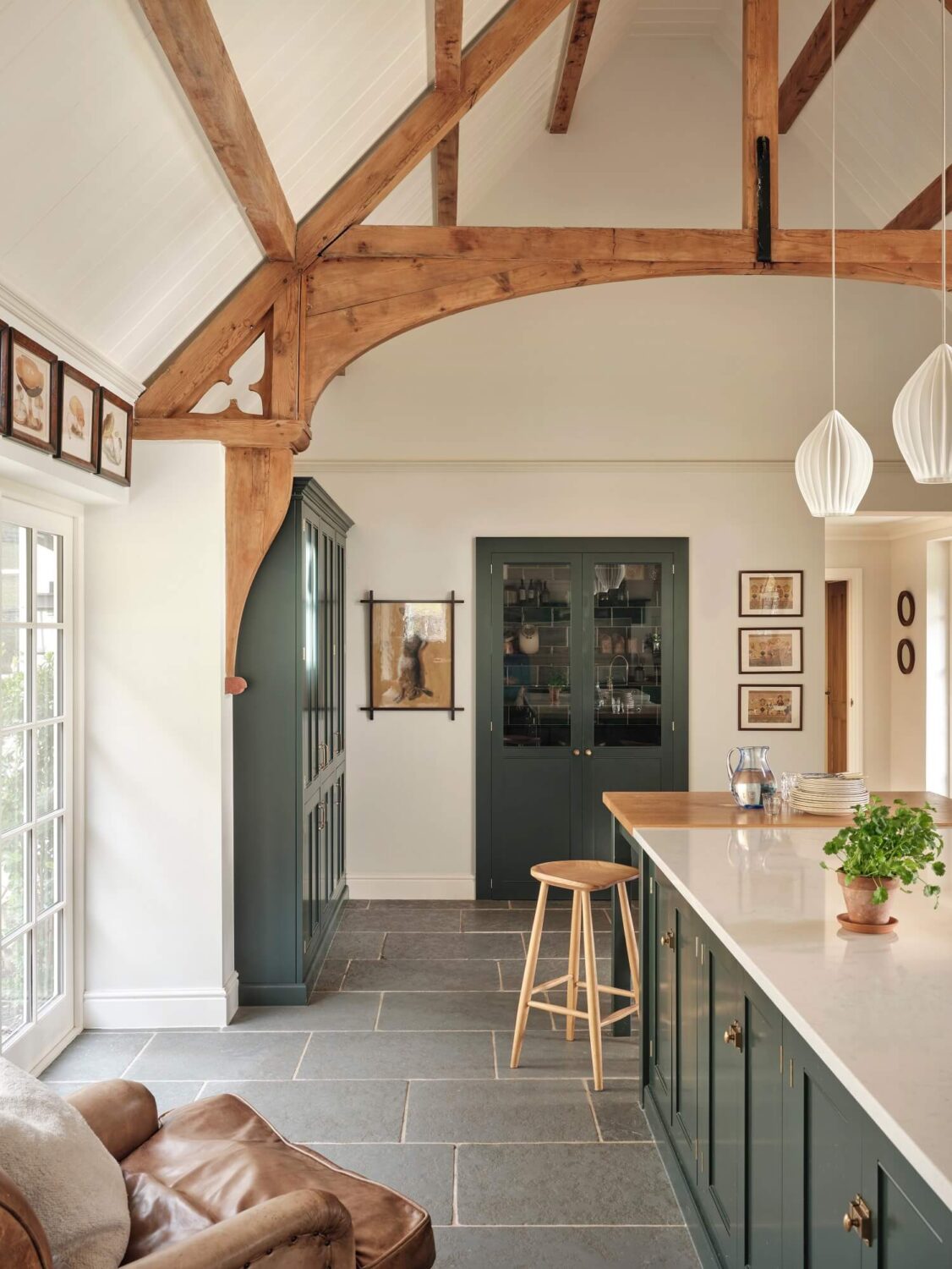 A Grand Family Kitchen in an English Country House 7 devol-kitchen-loft-ceiling-exposed-beams-blue-cabinets-nordroom
