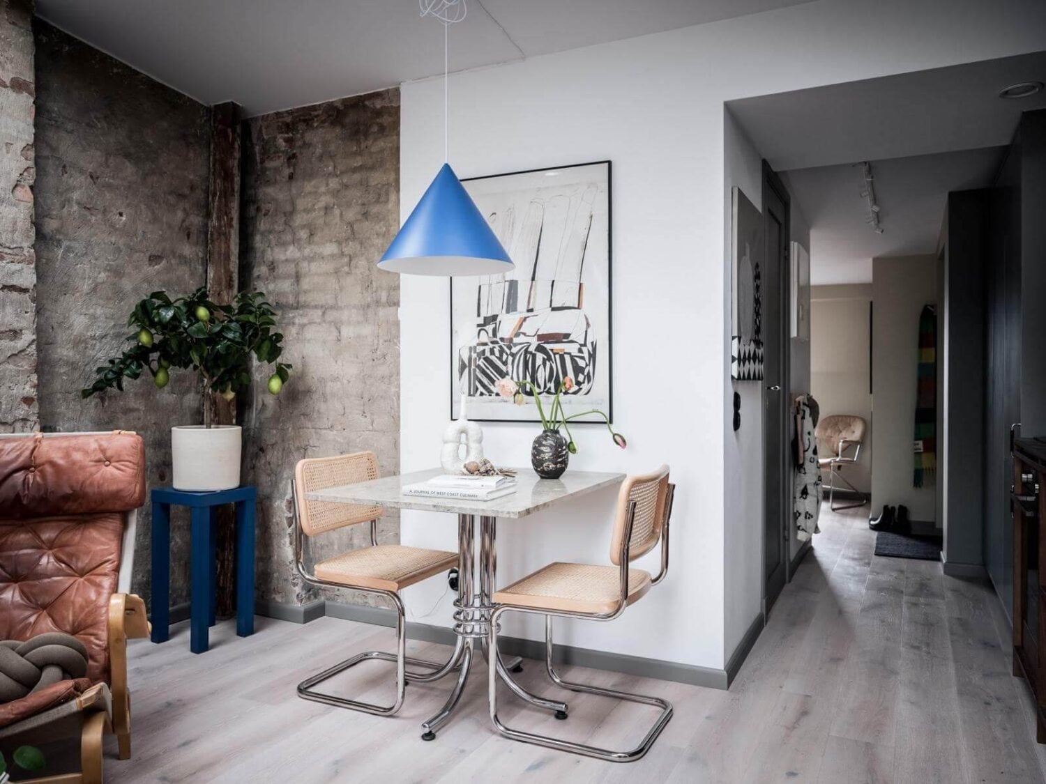 A Small Scandinavian Loft with Skylights and Brick Wall 6 dining-area-small-scandinavian-loft-apartment-nordroom