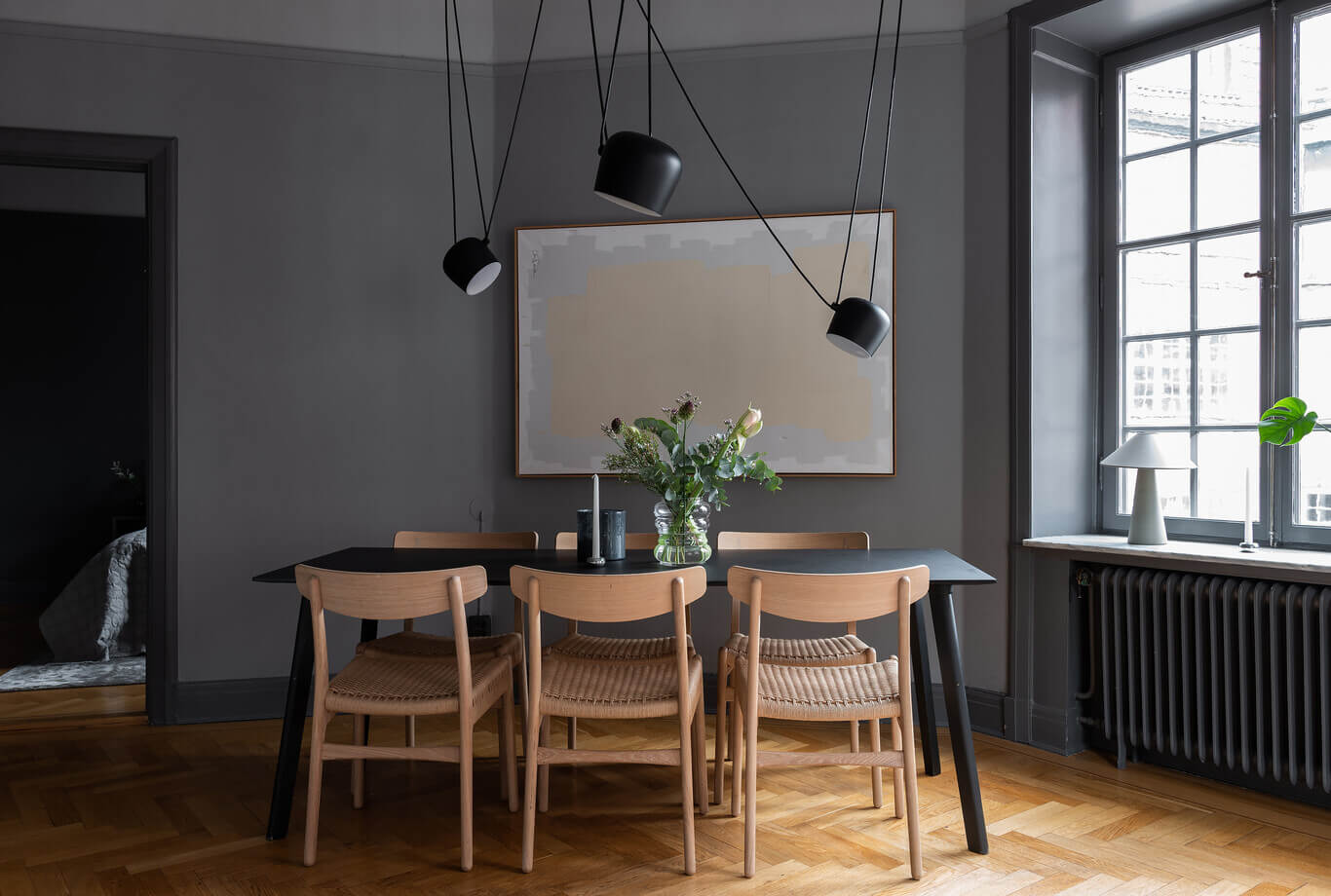 A Stylish Gray Apartment in Stockholm 5 dining-space-flos-pendant-gray-walls-nordroom