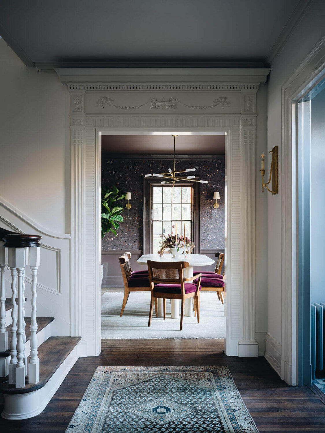 A Classic 1930s Home in Grand Rapids Designed by Jean Stoffer 25 foyer-hallway-dark-wooden-floor-dining-room-nordroom