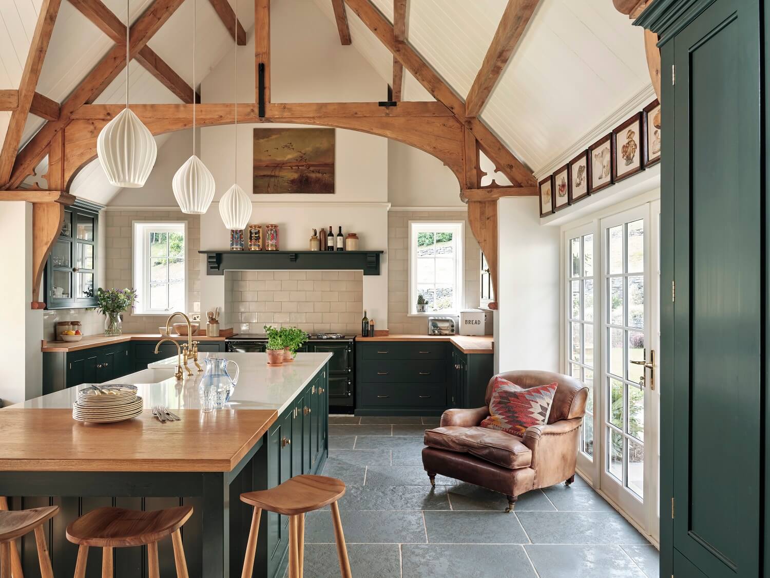 A Grand Family Kitchen in an English Country House 6 grand-rustic-kitchen-exposed-wooden-beams-leather-armchair-devol-nordroom