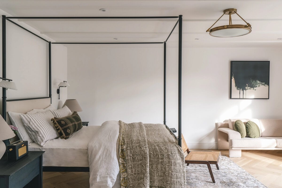 A Victorian Home with a Modern Black Extension 28 guest-house-white-walls-canopy-bed-nordroom