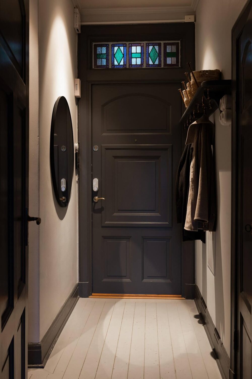 Behr Color of the Year 2024: Cracked Pepper 12 hallway-gray-front-door-round-mirror-nordroom