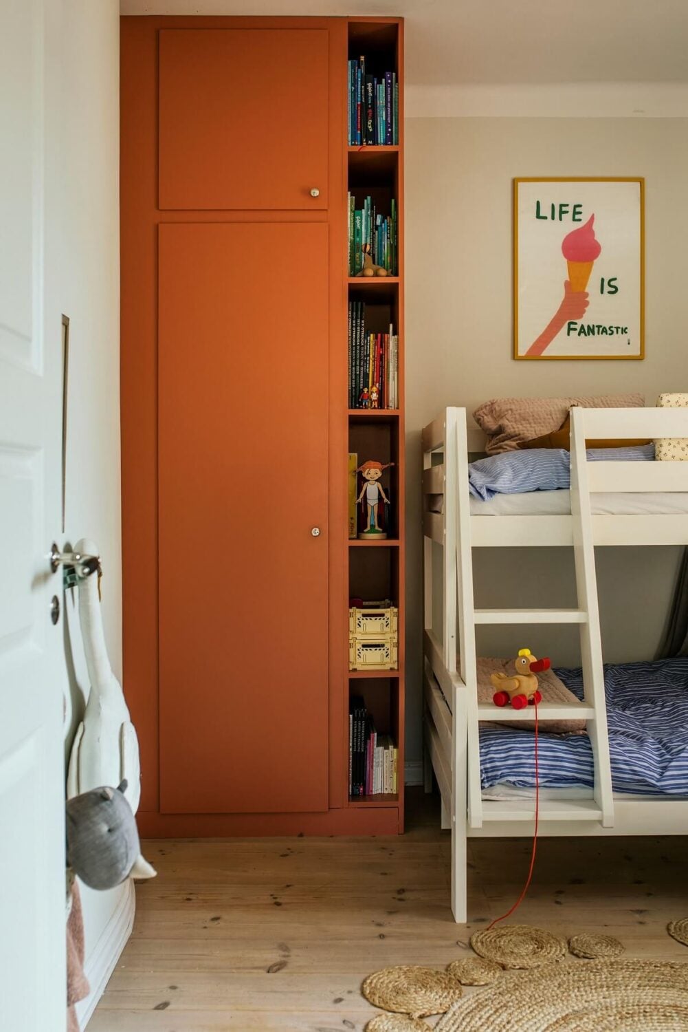 Best of 2023: Kids Rooms 18 kids-bedroom-bunk-beds-earthy-orange-wardrobe-nordroom