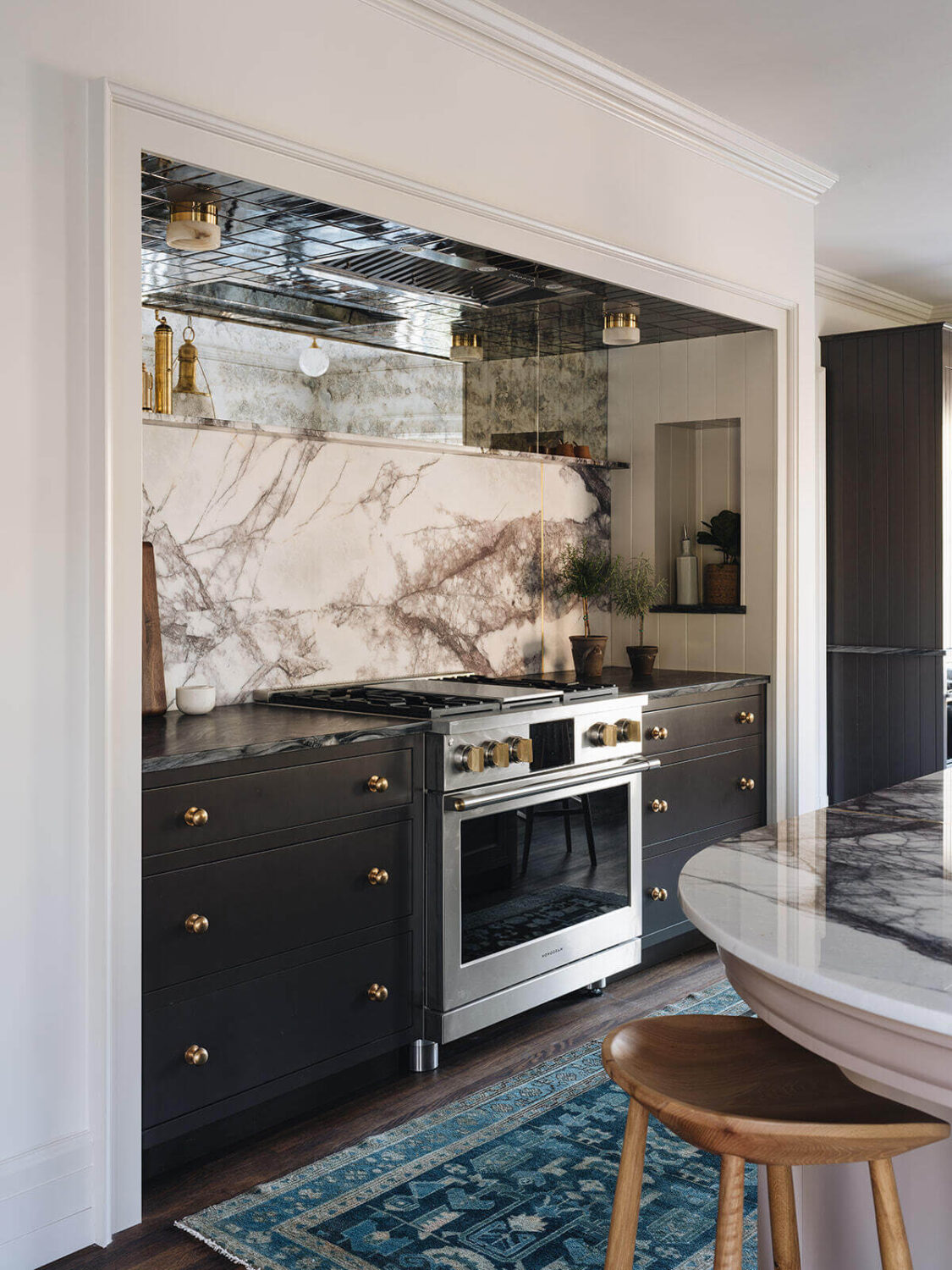 A Classic 1930s Home in Grand Rapids Designed by Jean Stoffer 10 kitchen-cooker-marble-backsplash-blue-runner-jean-stoffer-interior-desrgn-nordroom