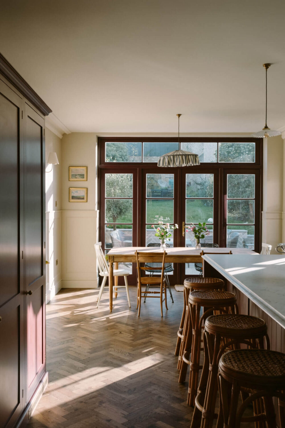 A Deep Red Kitchen in a Victorian Home in London 15 kitchen-island-dining-table-english-country-style-herringbone-floor-nordroom