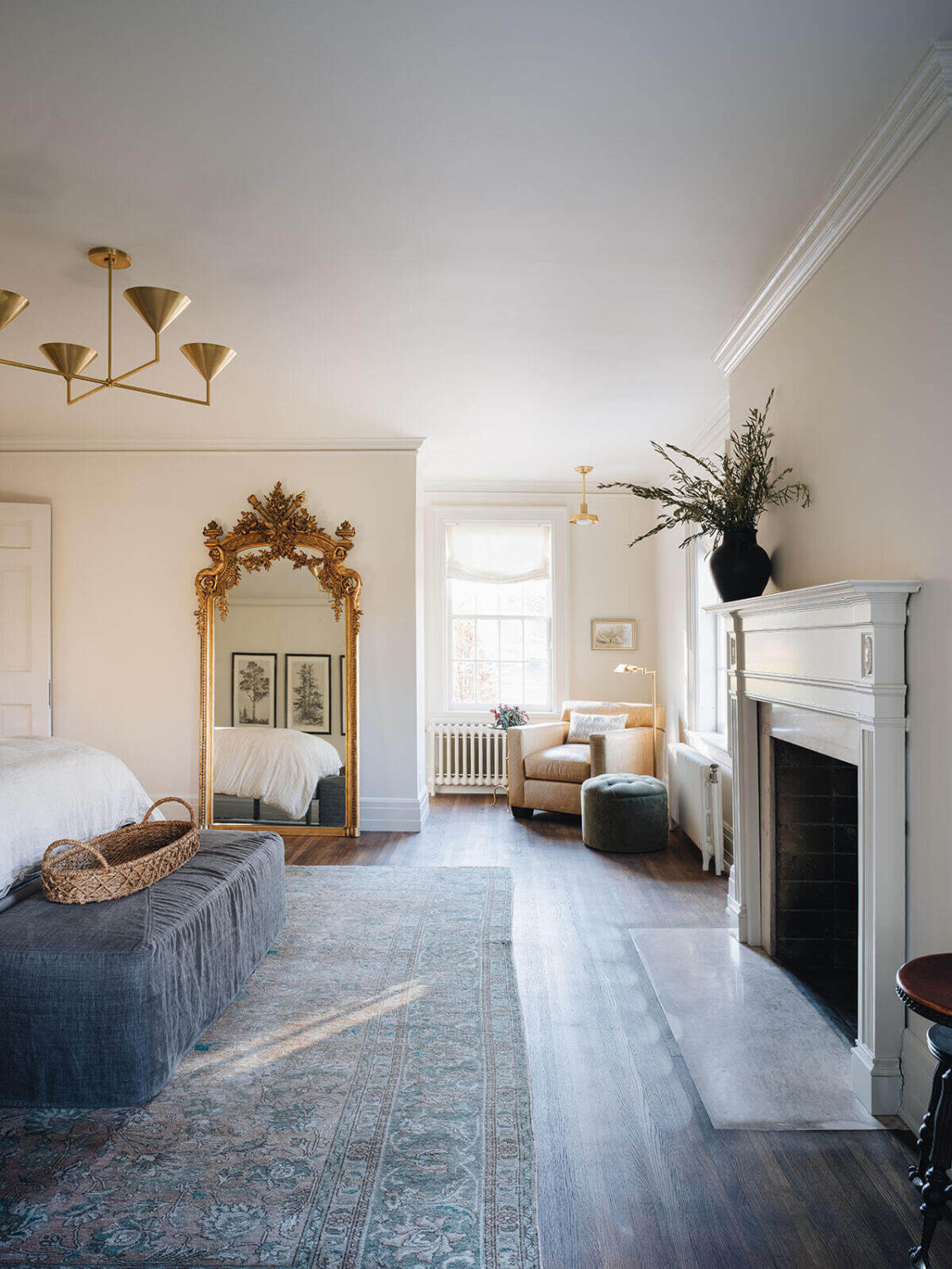 A Classic 1930s Home in Grand Rapids Designed by Jean Stoffer 27 large-master-bedroom-fireplace-area-rug-cozy-seating-area-antique-mirror-nordroom