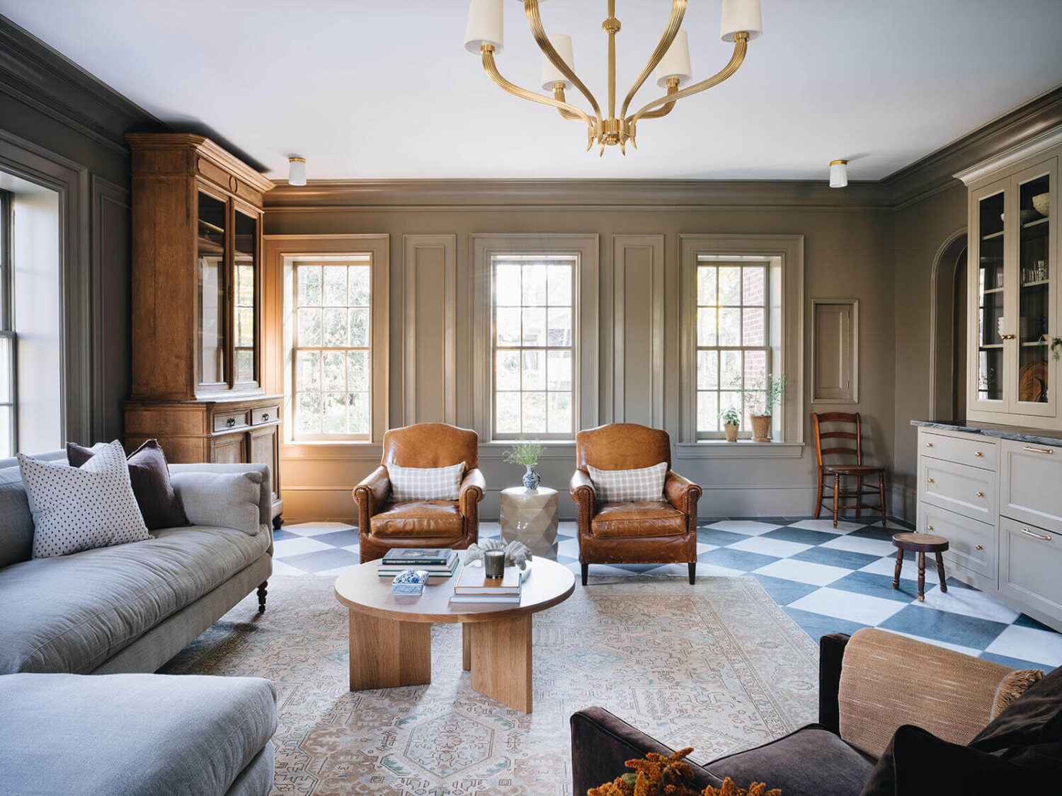A Classic 1930s Home in Grand Rapids Designed by Jean Stoffer 2 large-sitting-room-leather-club-chairs-checkerboard-floor-nordroom