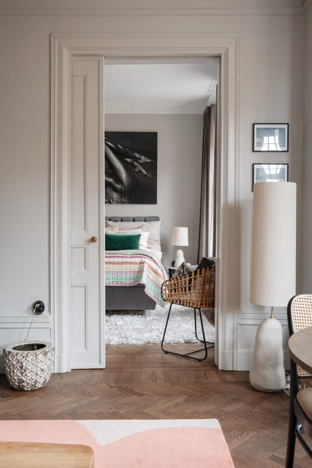 A Classic Swedish Apartment with Light Gray Walls 13 living-room-bedroom-pocket-door-parquet-floor-nordroom
