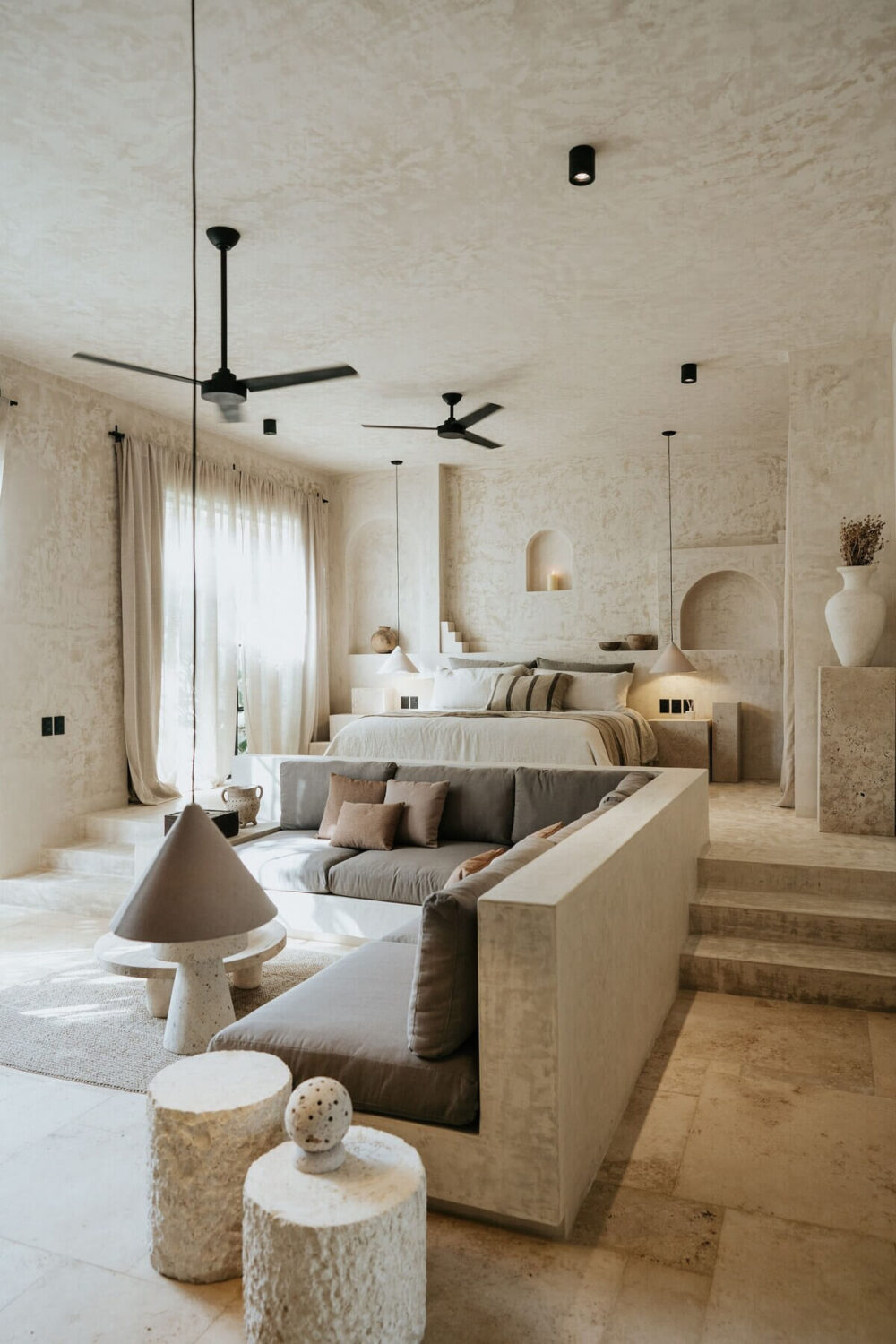 A Serene Design Apartment in Tulum 1 living-room-bedroom-sunken-sofa-raised-bed-nordroom