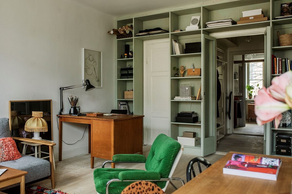 A Small Swedish Apartment Decorated in Midcentury Style 3 living-room-built-in-bookcase-green-vintage-desk-nordroom