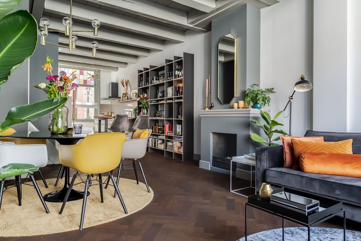 Gray and Earth Tones in a Restored Weavers House in The Netherlands 1 living-room-dark-wooden-floor-exposed-wooden-beams-fireplace-nordroom