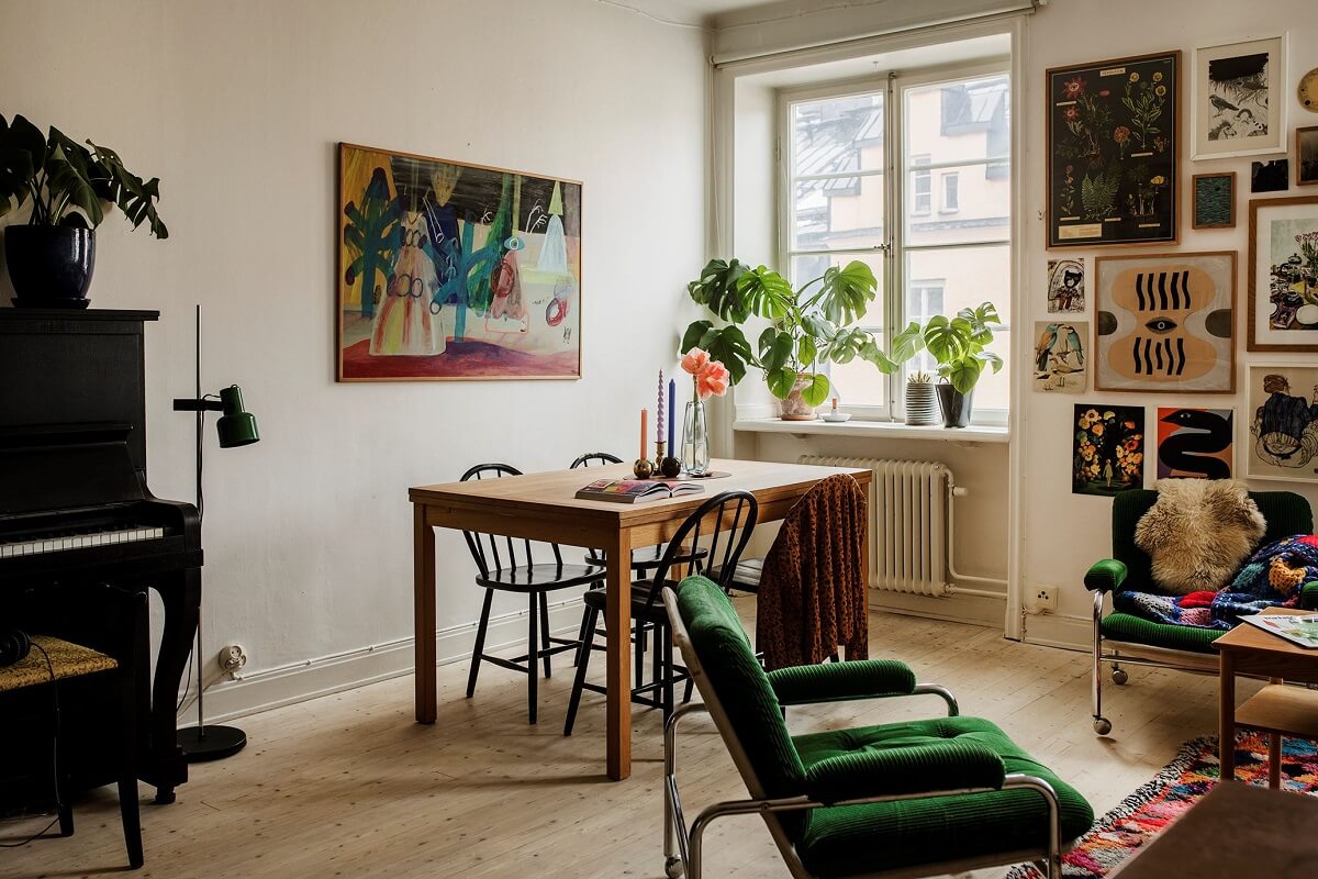 A Small Swedish Apartment Decorated in Midcentury Style 2 living-room-green-armchair-wooden-floor-gallery-wall-nordroom
