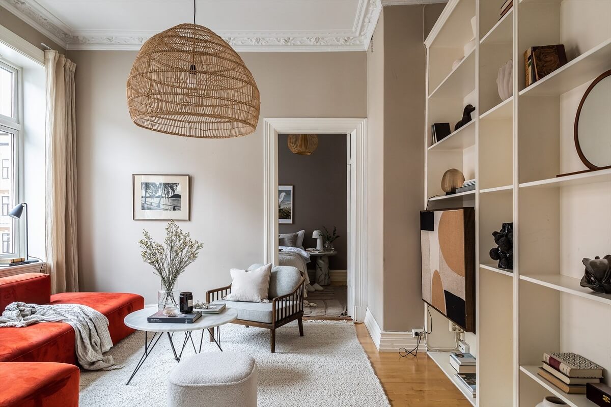 An Oslo Apartment Painted in Warm Color Tones 2 living-room-wooden-floor-large-rug-red-sofa-nordroom