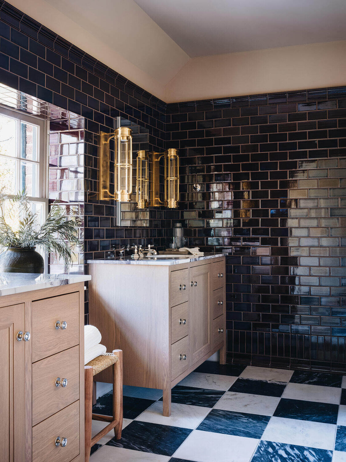 A Classic 1930s Home in Grand Rapids Designed by Jean Stoffer 30 master-bathroom-checkerboard-floor-tiles-dark-blue-wall-tiles-pink-bathroom-vanity-nordroom