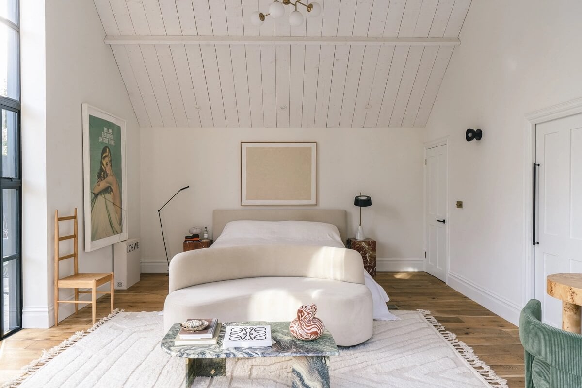 A Victorian Home with a Modern Black Extension 18 master-bedroom-white-aesthetic-sofa-pitched-roof-nordroom