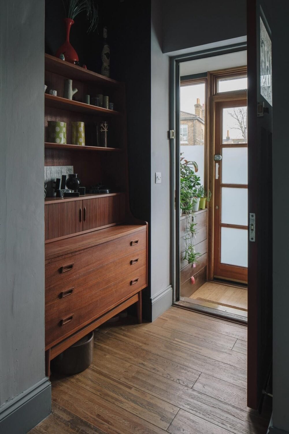 A London Home with Moody Rooms and a Pink Kitchen 9 moody-room-built-in-shelves-wooden-floor-nordroom