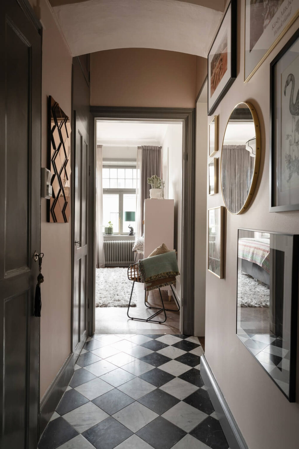 A Classic Swedish Apartment with Light Gray Walls 18 narrow-hallway-checkerboard-floor-gallery-wall-nordroom