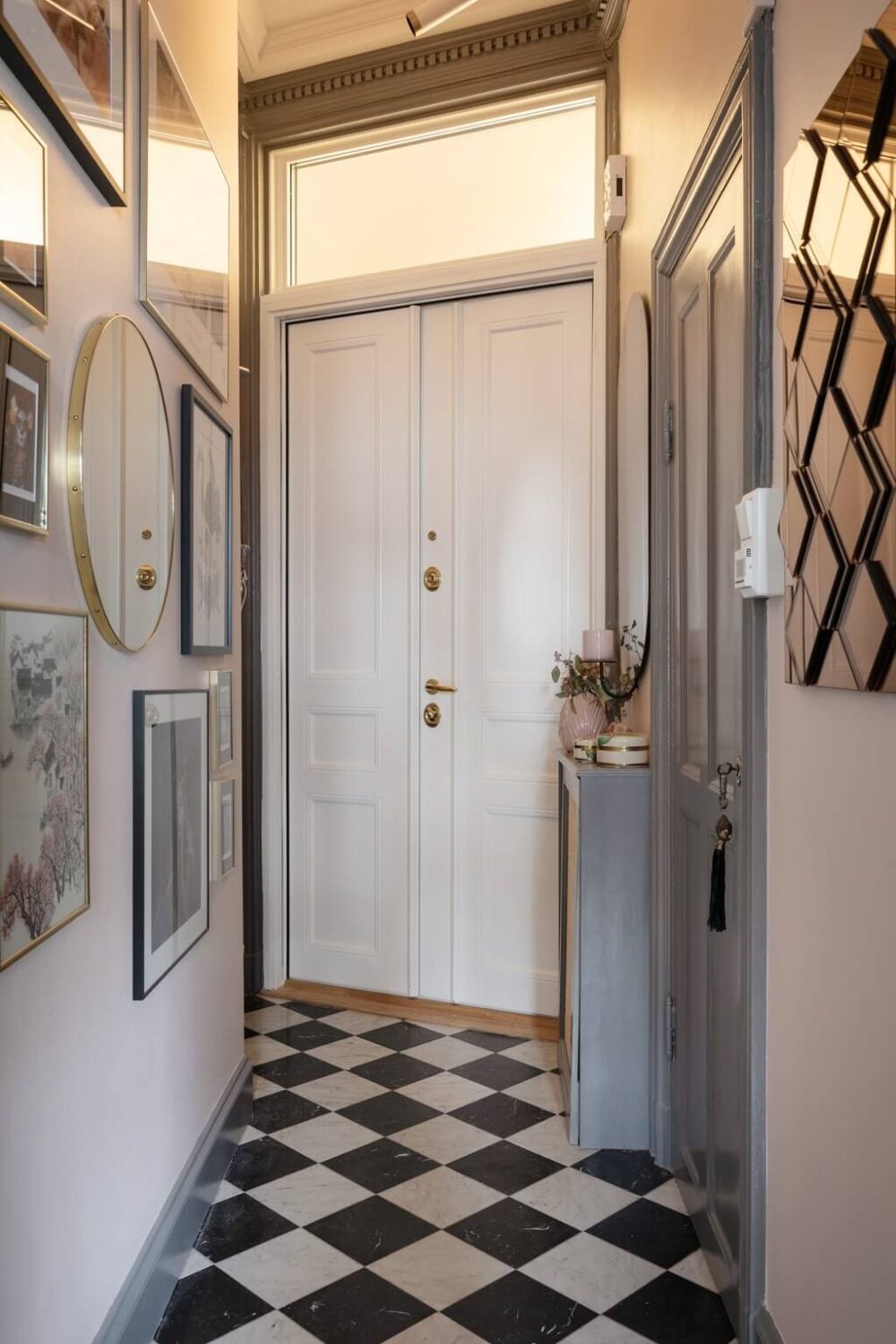 A Classic Swedish Apartment with Light Gray Walls 19 narrow-hallway-checkerboard-floor-nordroom