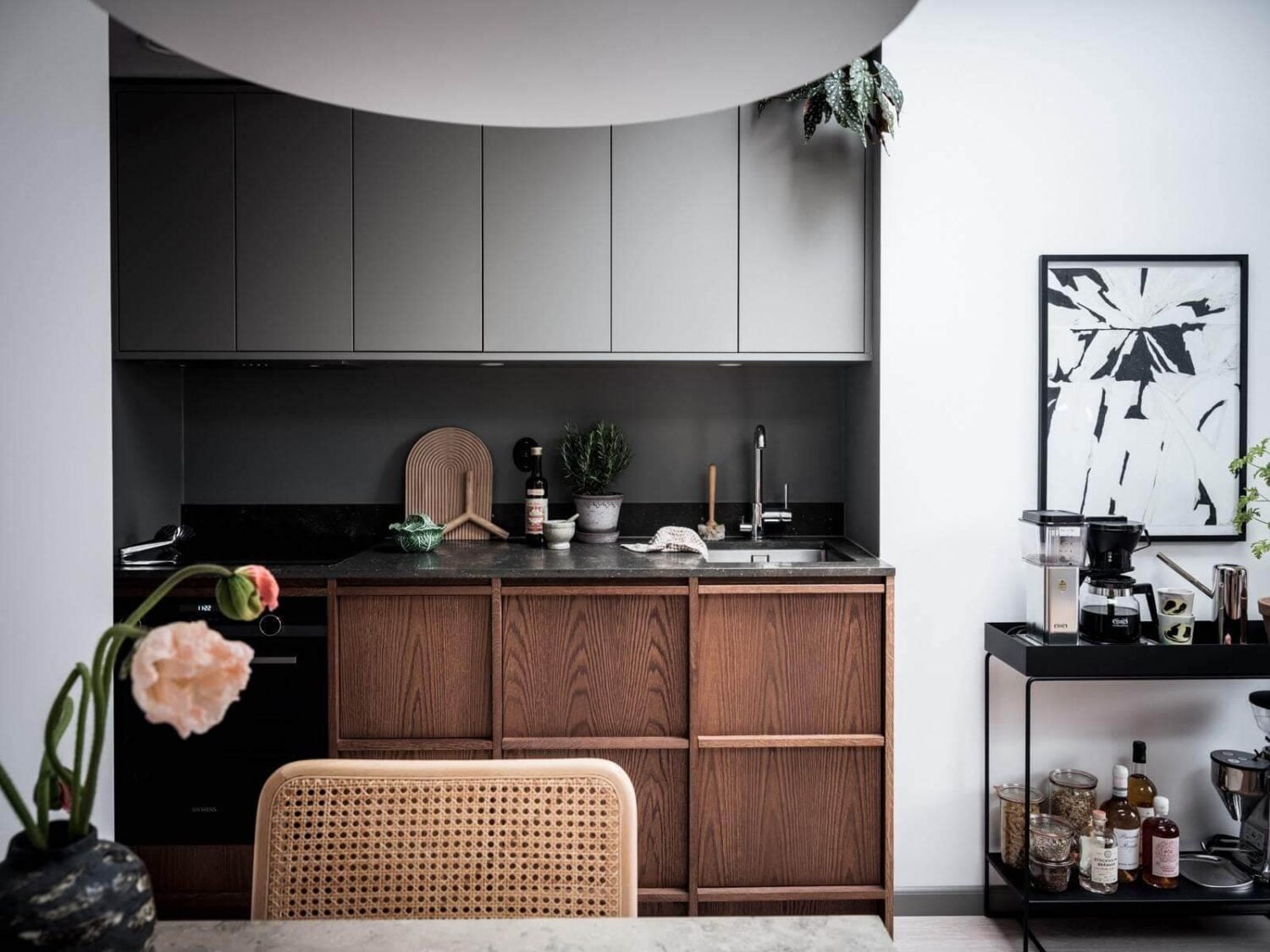 A Small Scandinavian Loft with Skylights and Brick Wall 9 nordiska-kök-kitchen-dark-stained-oak-cabinets-gray-upper-cabinets-nordroom