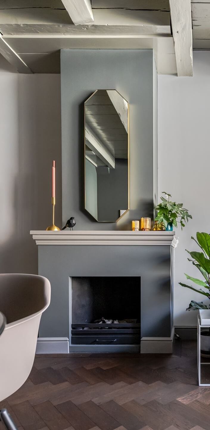 Gray and Earth Tones in a Restored Weavers House in The Netherlands 5 open-plan-living-room-fireplace-gray-walls-nordroom