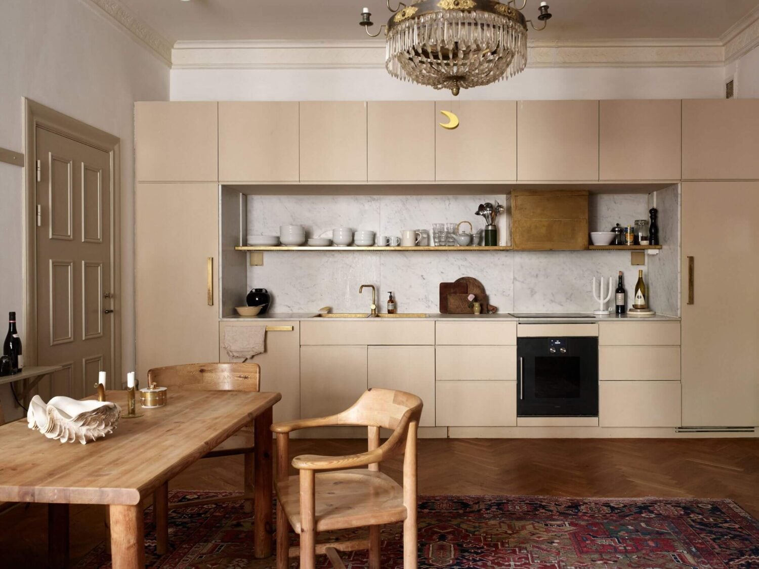 A Beige Vintage Apartment in Stockholm 8 open-plan-living-room-kitchen-beige-aesthetic-nordroom