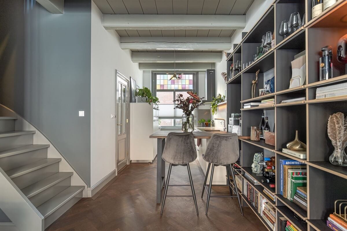 Gray and Earth Tones in a Restored Weavers House in The Netherlands 6 open-plan-living-room-kitchen-built-in-bookcase-gray-shades-nordroom