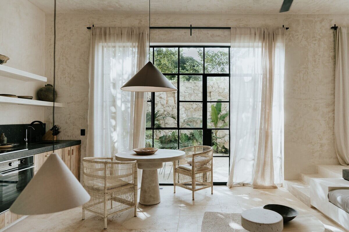 A Serene Design Apartment in Tulum 18 open-plan-living-room-kitchen-steel-terrace-doors-nordroom