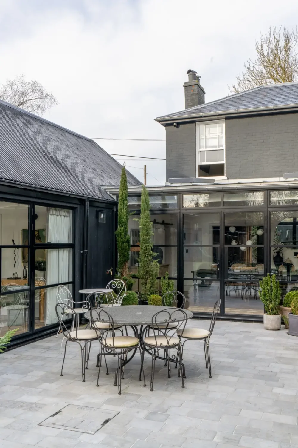 A Victorian Home with a Modern Black Extension 22 patio-dining-area-english-home-nordroom