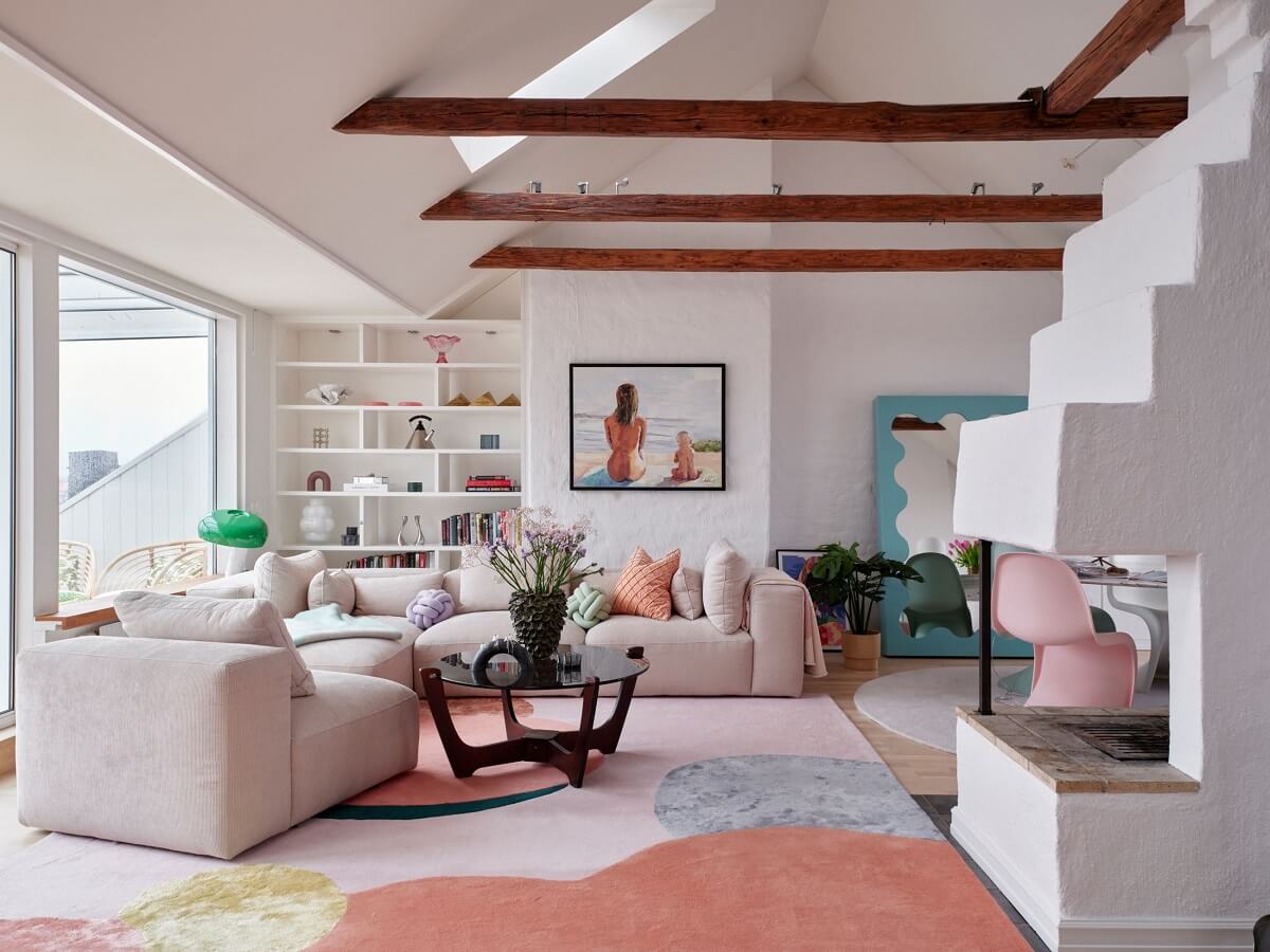Pastel Color Accents in a Scandinavian Penthouse Apartment 4 penthouse-living-room-exposed-beams-large-pastel-rug-nordroom