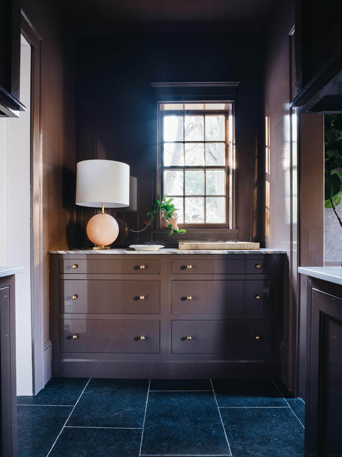 A Classic 1930s Home in Grand Rapids Designed by Jean Stoffer 16 plum-colored-cabinets-utlity-room-dark-gray-tiles-nordroom