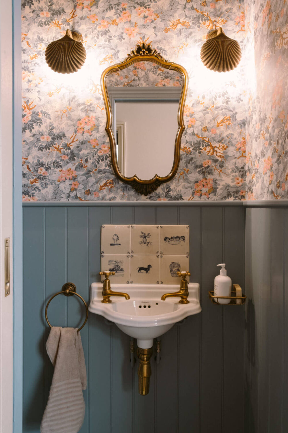 A Deep Red Kitchen in a Victorian Home in London 20 powder-room-wallpaper-antique-mirror-light-blue-wood-paneling-nordroom