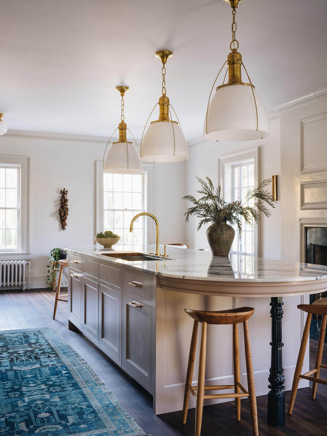 A Classic 1930s Home in Grand Rapids Designed by Jean Stoffer 13 rounded-kitchen-island-blue-runner-bar-stools-jean-stoffer-interior-design-nordroom