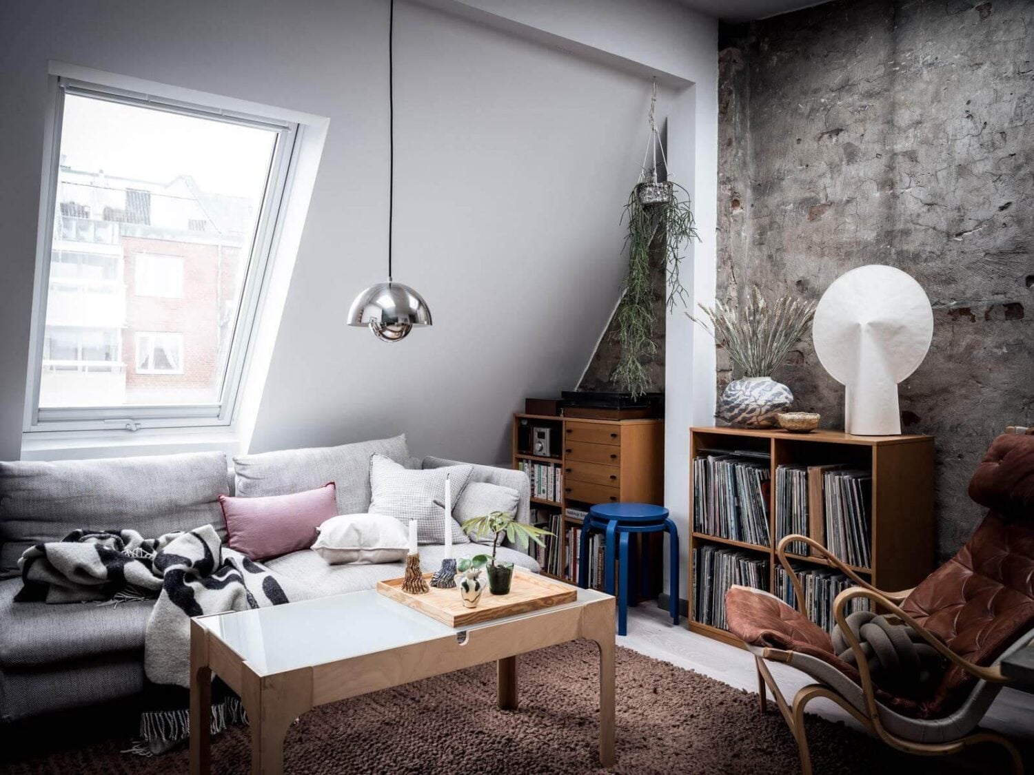 A Small Scandinavian Loft with Skylights and Brick Wall 4 seating-area-exposed-brick-wall-small-scandinavian-loft-nordroom