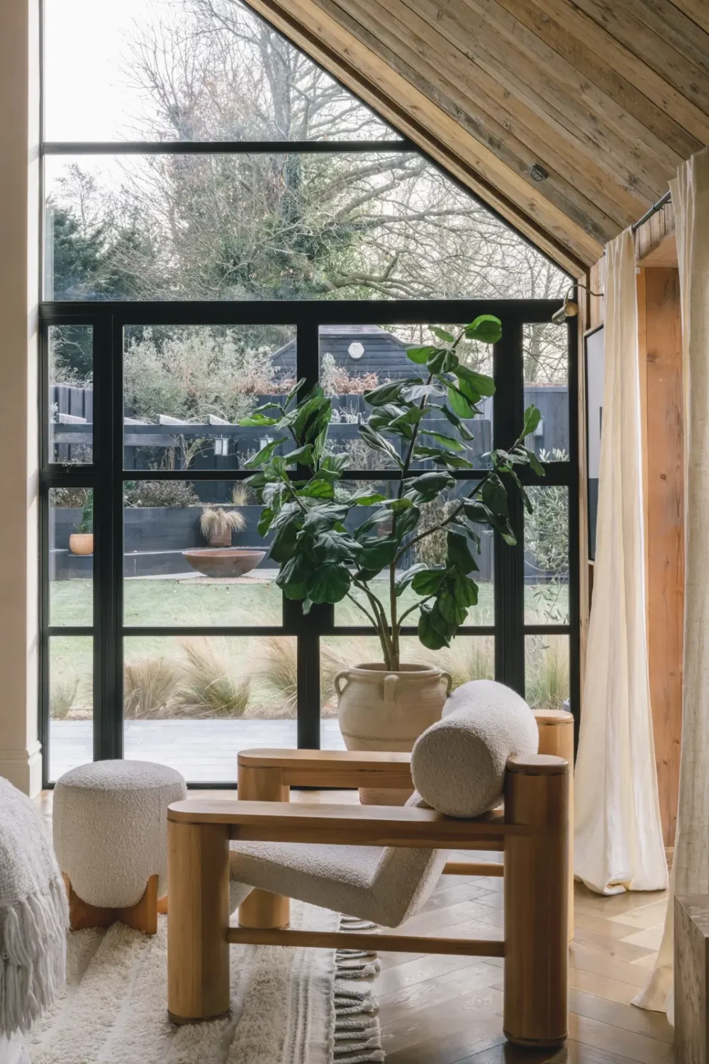 A Victorian Home with a Modern Black Extension 5 sitting-room-wooden-ceiling-garden-view-nordroom