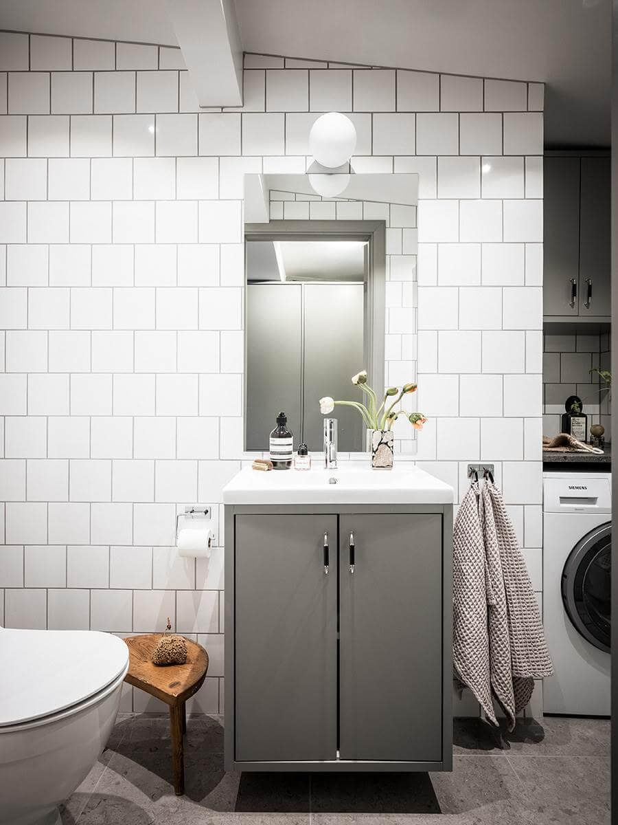 A Small Scandinavian Loft with Skylights and Brick Wall 15 small-bathroom-gray-white-tiles-washroom-niche-nordroom
