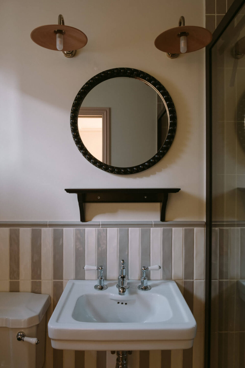A Deep Red Kitchen in a Victorian Home in London 32 small-bathroom-striped-tilework-round-mirror-nordroom