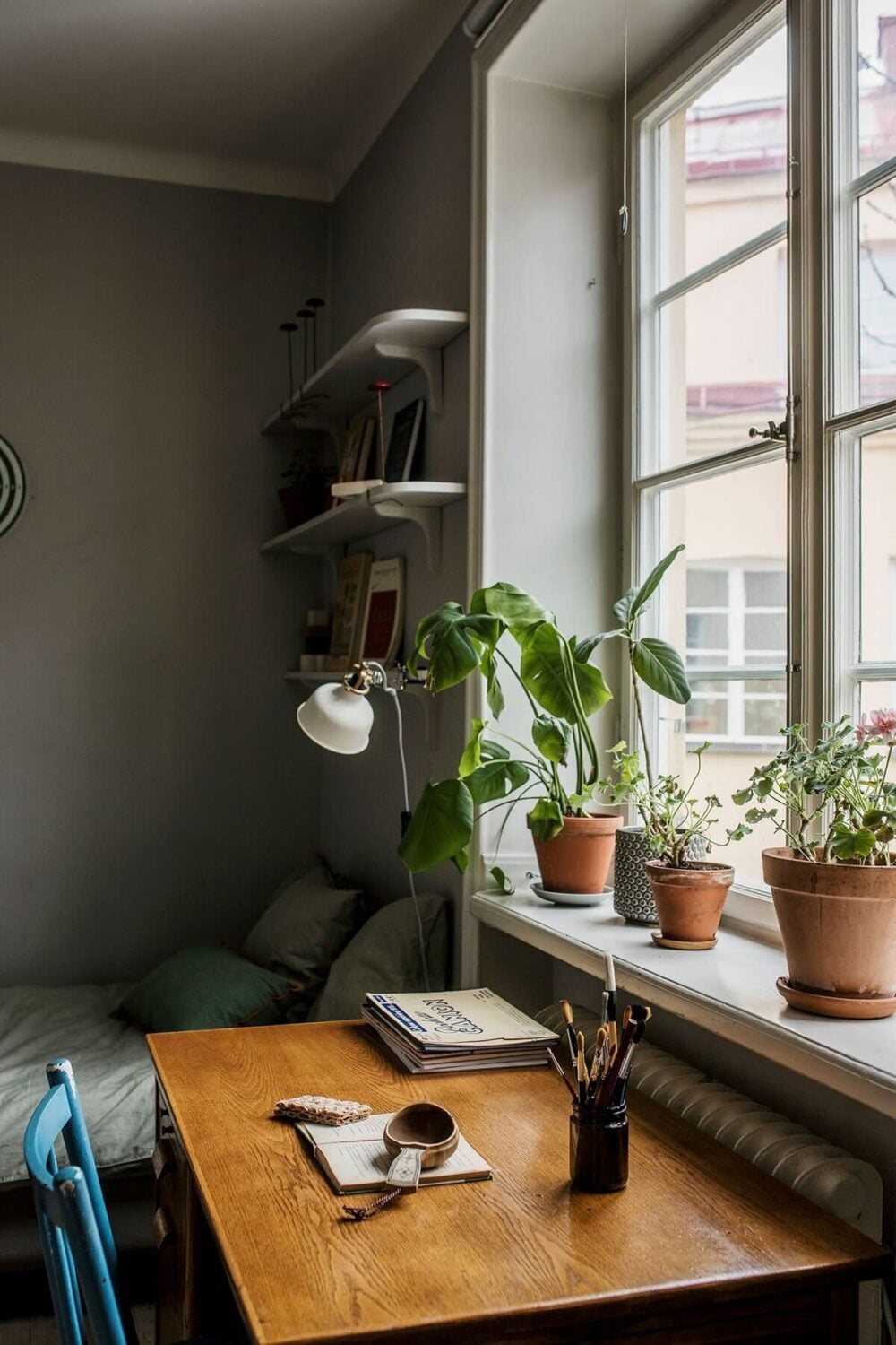 A Small Swedish Apartment Decorated in Midcentury Style 13 small-bedroom-desk-shelves-nordroom