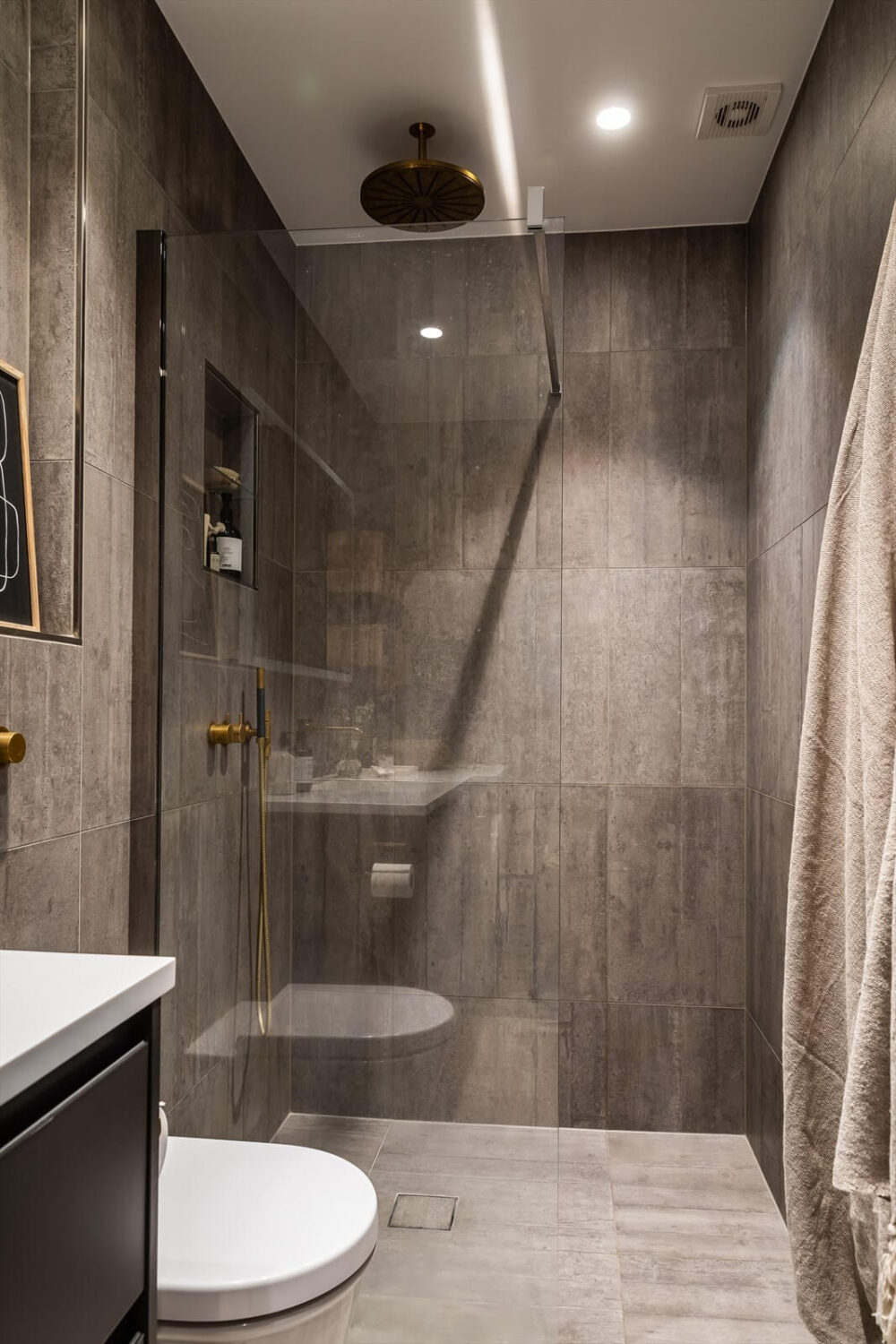 An Oslo Apartment Painted in Warm Color Tones 18 small-gray-bathroom-walk-in-shower-nordroom