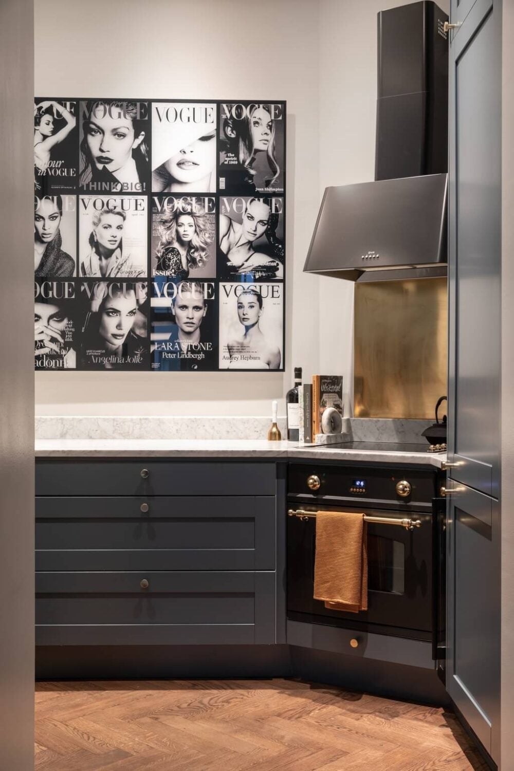 A Classic Swedish Apartment with Light Gray Walls 10 small-kitchen-gray-cabinets-brass-fixtures-nordroom