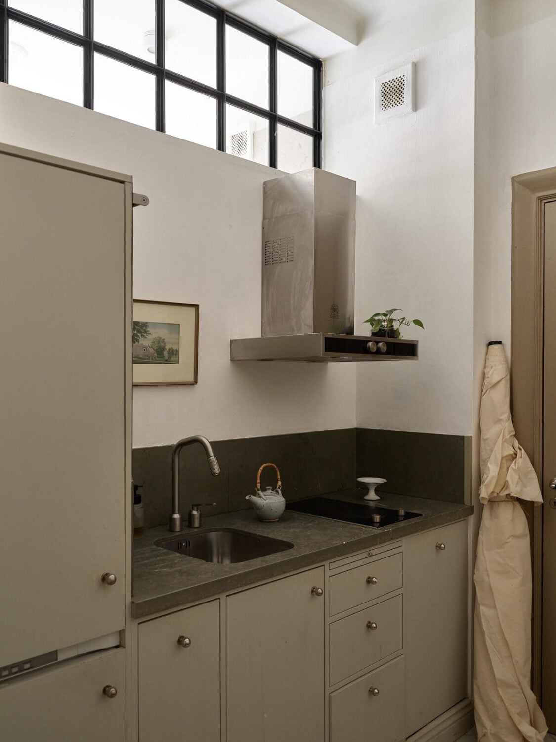 A Beige Vintage Apartment in Stockholm 24 small-light-gray-kitchen-utility-room-nordroom